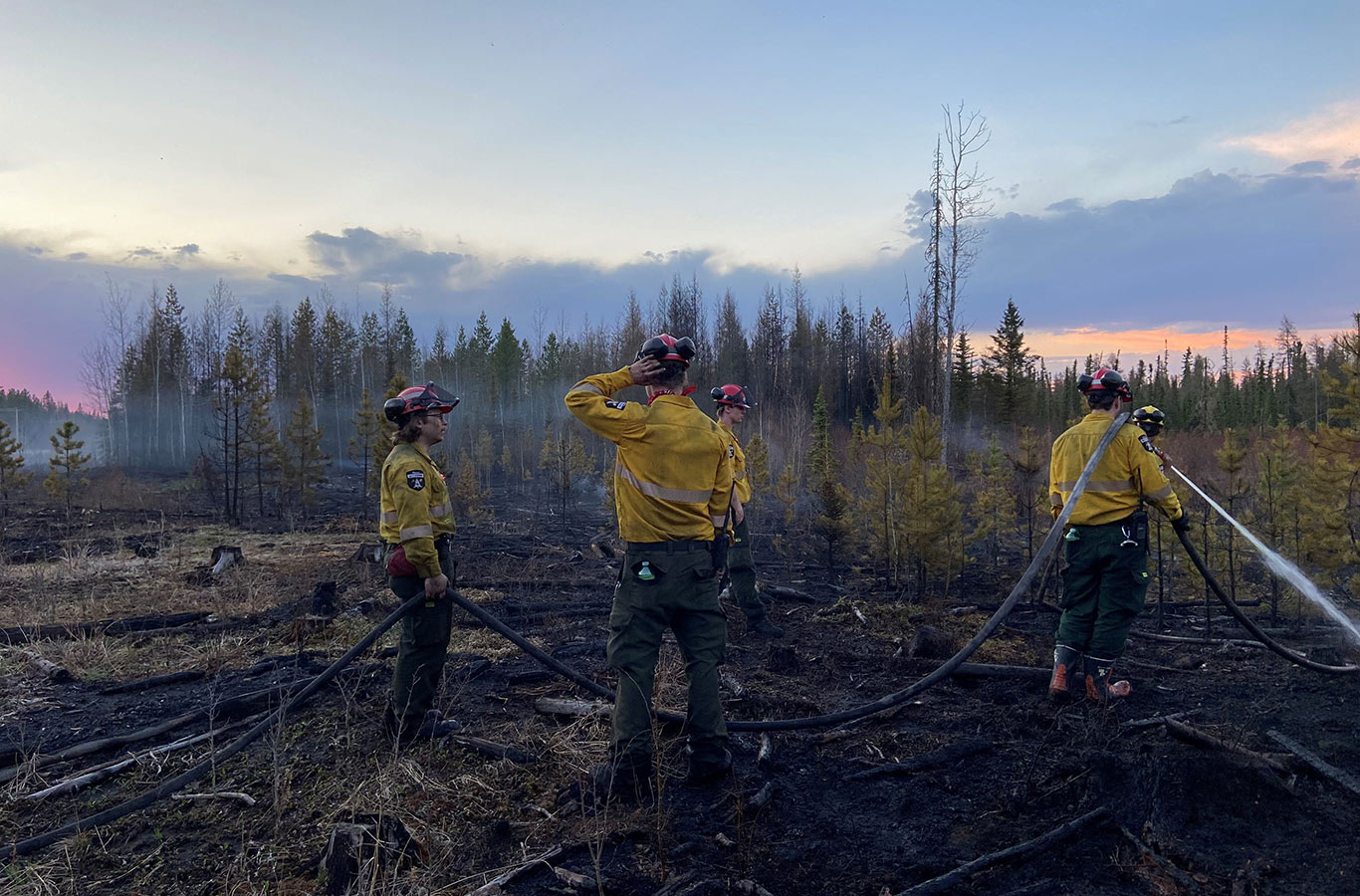 Firefighters at one of scores of wildfires burning in Edson, Alberta